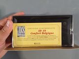 a person holding a box with a business card in it