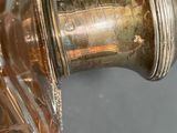 a close up of a glass bottle on a table