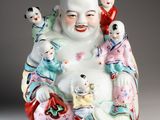 chinese porcelain figurine of a laughing buddha with five children