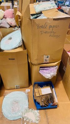 many boxes of stuff sitting on the floor in the store