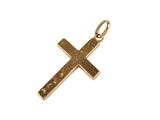 a close up of a gold cross on a white background