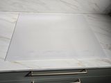 a marble counter top in a bathroom with gold handles