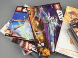 a lot of lego star wars books on the table
