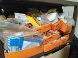 many boxes of items that are sitting on a shelf
