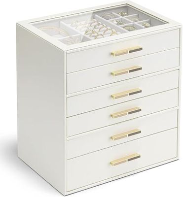 une boîte à bijoux blanche avec des poignées dorées et des tiroirs