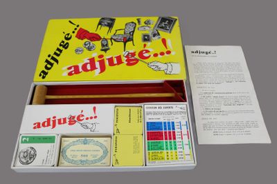 a box with a card game inside of it on a table