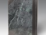 an image of a book with a marble cover on a gray background