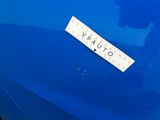 a sticker on the hood of a blue car