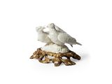 two birds that are sitting on top of a tree stump