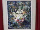 painting of white flowers in a white frame on a red wall