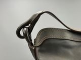 a close up of a purse with a strap on it