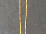 gold plated necklace with a pendant with a picture of a woman