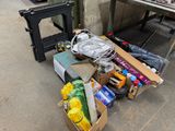 a box full of assorted items sitting on the ground