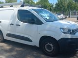 a white van that is parked in a parking lot