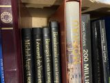 many books that are on the shelf together