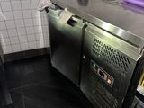 a stainless steel counter in a small kitchen
