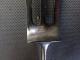 a fork that is sitting on top of a piece of luggage