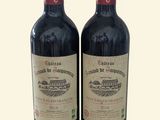 deux bouteilles de vin posées l'une à côté de l'autre sur une table
