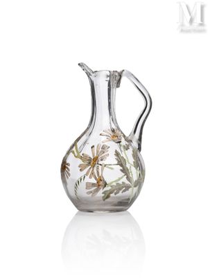a glass vase with a floral design on it