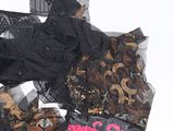 many different types of clothing on a white surface