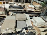 many different types of stone on the ground in the yard
