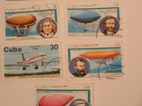 plusieurs timbres représentant un avion, un avion, un avion et un ballon