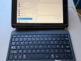 a tablet computer sitting on a table with a note on it