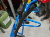 a pair of scissors that are sitting on a rack