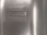 a close up of a metal object on a white surface