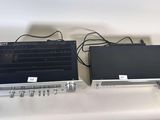 two electronic devices that are sitting on a table