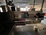 an image of a kitchen with a lot of clutter on the counter