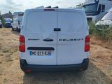 a white van that is parked in a lot