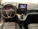 the interior of a car with a steering wheel, dashboard, and dashboard controls