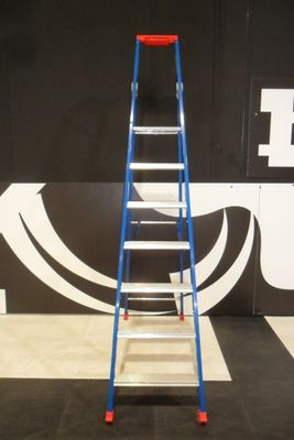 a ladder that is standing in front of a wall