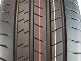 the tire of a car with a red line painted on it