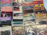 a lot of cd ' s that are sitting on a table