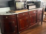 a television on a cabinet in the corner of a room
