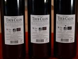 three bottles of wine that are sitting on a table
