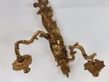 pair of antique brass wall sconces in the form of a man and woman