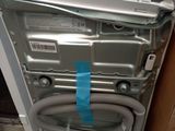 a dishwasher that has a hose attached to it