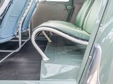 a green seat in the back of a green car