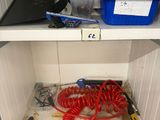 a shelf with a bunch of tools on it