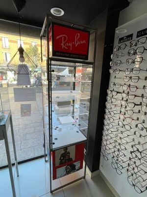 many glasses on display in the window of a store