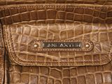 an image of a brown purse with a name on it