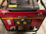 a red and black portable generator sitting on top of a wooden pallet