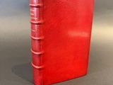 a red book sitting on top of a table