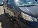 an image of a van that is parked in a parking lot