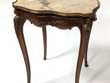 an image of a small table with a marble top on a white background