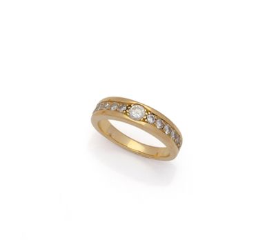 a gold ring with diamonds on a white background