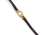 une montre-bracelet en or et cuir avec un cadran blanc